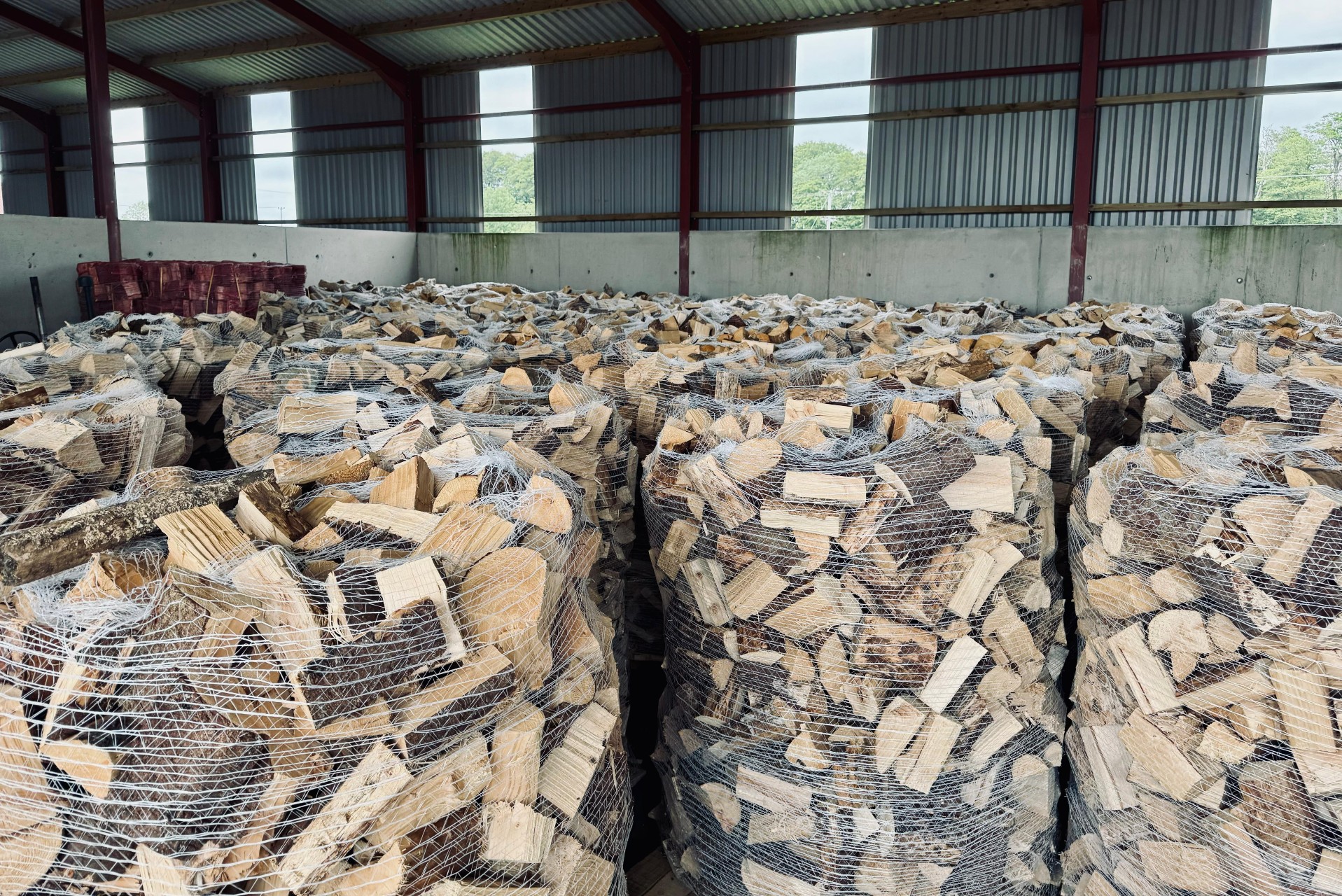 Firewood pallets stored inside